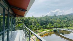 a balcony with a view of a river and a bridge at Thiên Vy Homestay in Phú Quốc