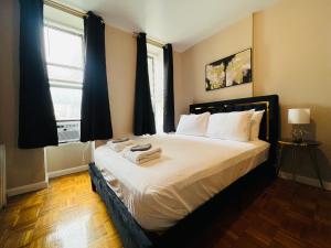 En eller flere senge i et værelse på The Cityline Residences