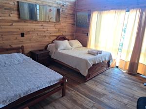 En eller flere senge i et værelse på Casa Dango Bariri