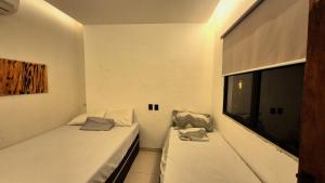 En eller flere senge i et værelse på Casa de Praia com Piscina em Maceió - Ipioca - Sauaçuhy + 42 billeder