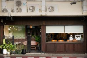 a store front of a building with a window at Nap Old Town in Bangkok