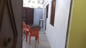an alley with two chairs and a table and a sink at Khans villa in Hyderabad +5 photos