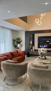 Et opholdsområde på Goosebumps Luxury Homes & Apt