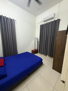 En eller flere senge i et værelse på Banglo Jasin Perdana