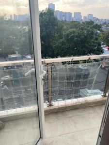 an open window with a view of a city at Không có tên in Ho Chi Minh City