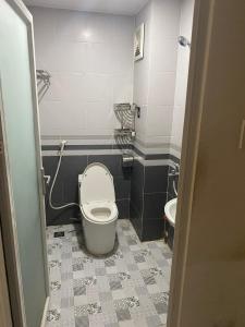 a bathroom with a toilet and a sink at Không có tên in Ho Chi Minh City