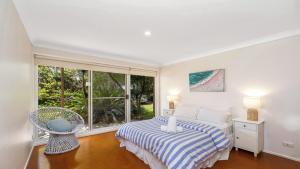 En eller flere senge i et værelse på Beach Point - Wifi, Pet Friendly & Airconditioned