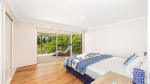 En eller flere senge i et værelse på Beach Point - Wifi, Pet Friendly & Airconditioned