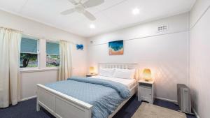 En eller flere senge i et værelse på Coastal Soul - Pearl Beach