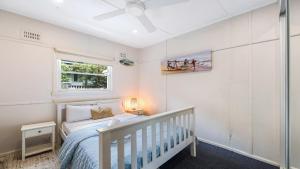 En eller flere senge i et værelse på Coastal Soul - Pearl Beach + 8 billeder