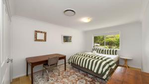 En eller flere senge i et værelse på Paradise - Pearl - Modern With Wifi