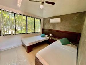 Postel nebo postele na pokoji v ubytování Villas Náutico Chairel