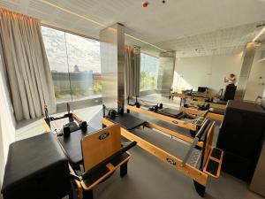 a gym with rows of chairs and a person standing in the window at Concepcion Live in Buenos Aires +188 photos