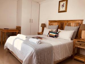 Ένα ή περισσότερα κρεβάτια σε δωμάτιο στο MELJAA GROUP Guesthouse