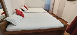 a pair of beds in a room at Marlin Beachway Rooms- Baga Beach in Baga
