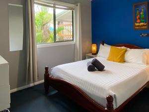 Postel nebo postele na pokoji v ubytování KiteSurf House