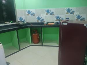 Køkken eller tekøkken på Sarthik's guest house