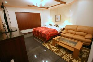 Postel nebo postele na pokoji v ubytování Hotel Sari Resort Takinoyashiro (Adults Only)