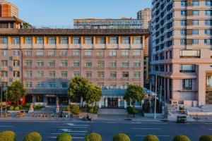 a large building with a courtyard in a city at Xana Hotelle Xi'an GONG IP South Gate of Zhonglou in Xi'an