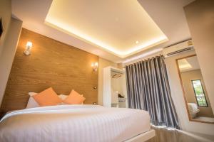 Vuode tai vuoteita majoituspaikassa Le Terrarium Bed & Sleep Chiang Rai