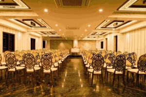 a room with rows of chairs in a hall at NTS Nirvana Suites in Bangalore