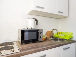 Kuchyň nebo kuchyňský kout v ubytování Selak Apartments