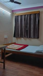 Postel nebo postele na pokoji v ubytování Hotel J P Lodge Kalimpong
