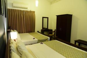 Postel nebo postele na pokoji v ubytování Cinnamon villa 30