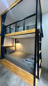 a couple of bunk beds in a room at Cosy Hostel in Ko Tao