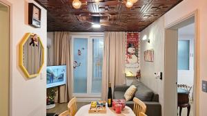 a living room with a table and a couch at BinsHeim HBC - Seoul's Aesthetic Stay with the best Night view Rooftop in Seoul