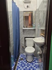 a bathroom with a toilet and a sink at Tipid Camp Baguio A2,A3,A7,A8 in Baguio +44 photos