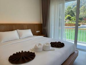 En eller flere senge i et værelse på Hidden Haven Resort Koh Lanta