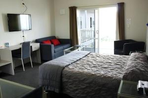 Postel nebo postele na pokoji v ubytování Hawera Central Motor Lodge + 104 fotografií