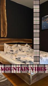 En eller flere senge i et værelse på Forest Dream Bjelasnica