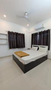 a bedroom with a large bed in a room at Dream stay villaa in Pondicherry +17 photos