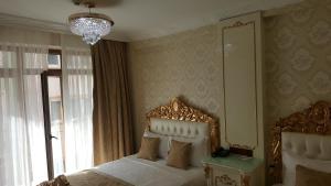 Postel nebo postele na pokoji v ubytování Best Town Hotel