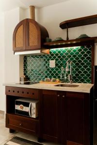 Η κουζίνα ή μικρή κουζίνα στο Maison Nhã 28 Mạc Đĩnh Chi