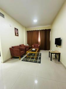TV a/nebo společenská místnost v ubytování Al Khaleej Plaza Furnished Hotel Apartments + 16 fotografií