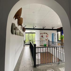 an arched hallway with a staircase in a house at Jrai Homestay in Pleiku +29 photos