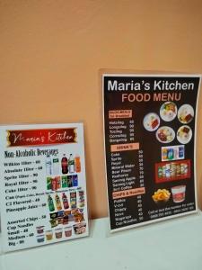 two signs on the wall of a food menu at Tipid Camp Baguio A4,A5,A6 in Baguio