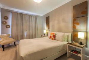 Кровать или кровати в номере Odyssey of South Beach Apart Hotel