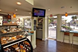 a bakery with a display case in a store at City Loft Hotel in Beaufort