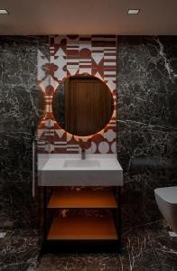 a bathroom with a sink and a mirror at Castellion Hotels Galata in Istanbul