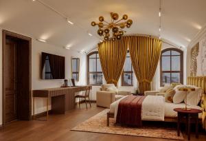 a bedroom with a bed and a desk in a room at Castellion Hotels Galata in Istanbul