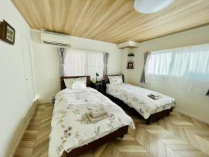 Postel nebo postele na pokoji v ubytování 横浜黄金町民泊