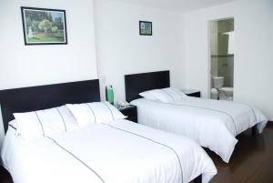 Postel nebo postele na pokoji v ubytování Hotel Real Estación + 37 fotografií