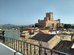 a view of a city with a castle in the background at Casa La Arracada in Villena