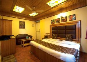 Postel nebo postele na pokoji v ubytování Hotel Lal's Haveli