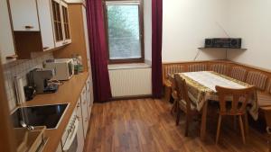 a kitchen with a table and a dining room at Rentcenter79 in Vordernberg +50 photos