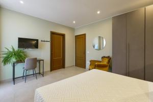 TV/trung tâm giải trí tại Domus Fabia - Rooms & Apartments